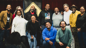 A group shot of all of the poets on stage